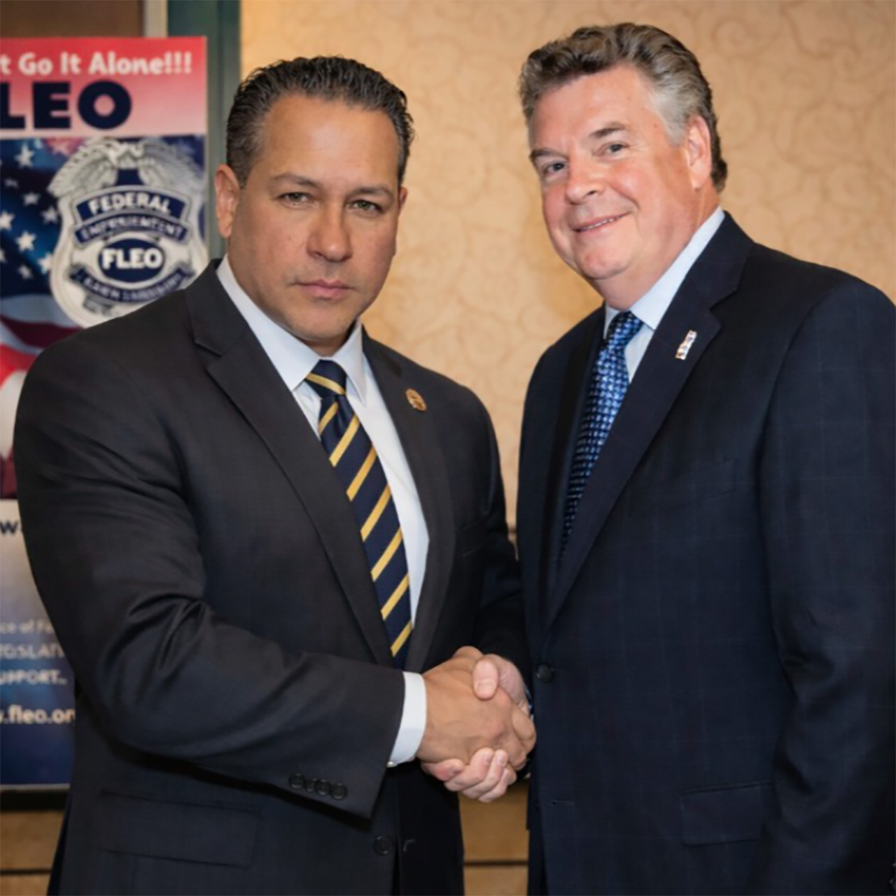 A professional security officer in a clean white uniform and cap, holding a walkie-talkie and looking alert while on duty. The uniform features a 'Security' gold embroidery and an official Guardion Protection badge.